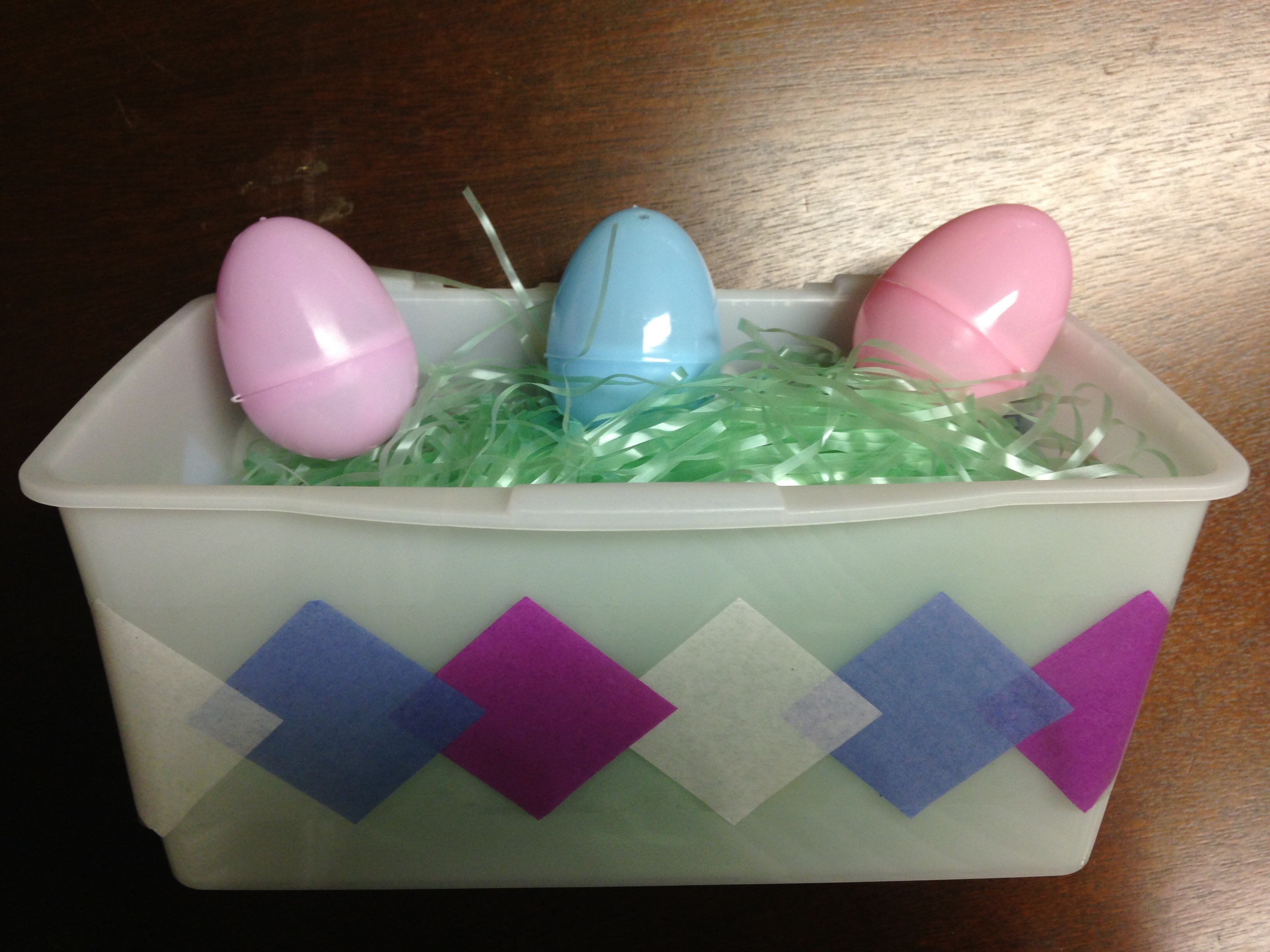 A fun, homemade egg basket from a wipes box, contact paper, and tissue paper! More great ideas at the Bitty-Bits Blog!